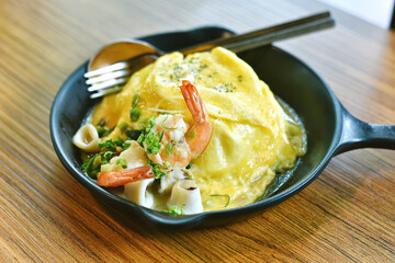 Breakfast in the morinng, Creamy omelette with shrimp and squid, Scrambled eggs with seafood and green onion.