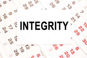 Fototapeta premium text INTEGRITY on a sheet from Notepad.a digital background. business concept . business and Finance.