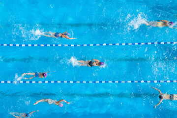 People training in swimming pool, top view