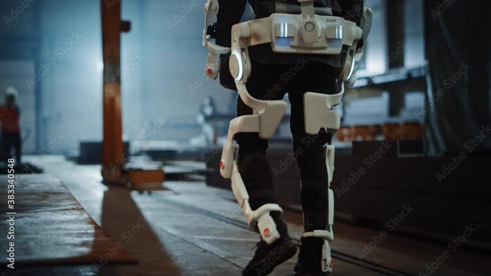 Poster black african american engineer is testing a futuristic bionic exoskeleton and proudly wearing it in