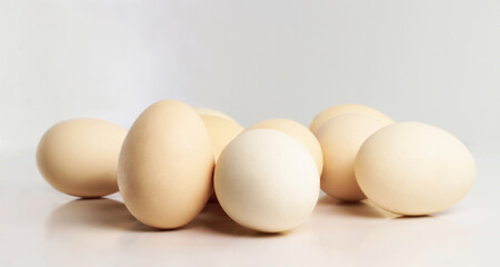 Chicken eggs on a white background. White egg. Side view