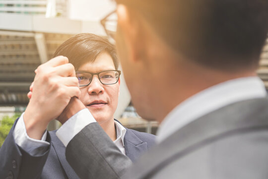 Businessman shaking hands and hold hands finishing meeting or deal successful
