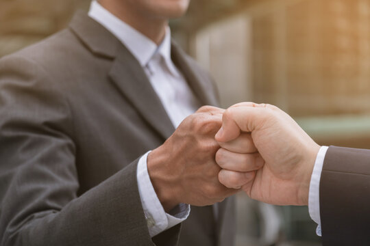 Businessman shaking hands, hands bump, finishing up meeting. Deal Successful businessmen on public