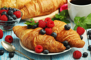 Croissants with fresh berries for breakfast