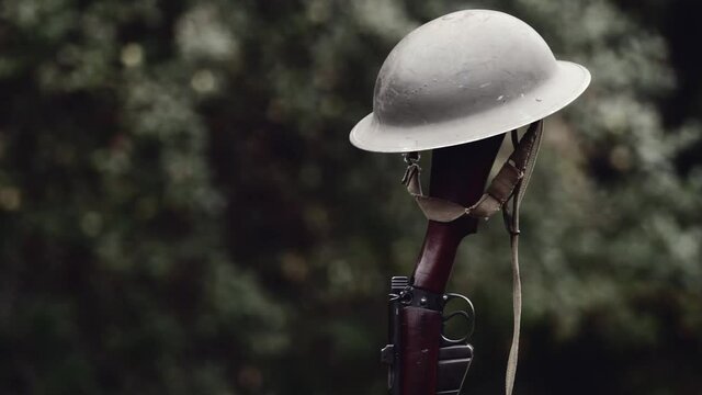 World War era Brodie helmet and rifle