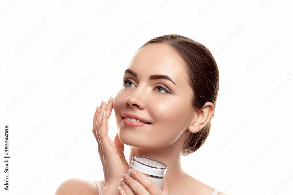 Wall mural Beautiful Woman with clean skin. Skin Care. Cosmetics. Facial treatment. Moisturizing cream. Cosmetology, beauty and spa