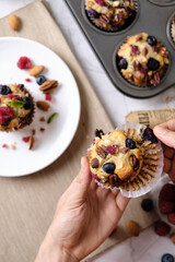 mixed berry low carb Keto Diet muffin with almond and nut. set on cafe table.