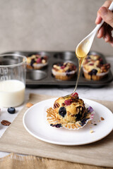 mixed berry low carb Keto Diet muffin with almond and nut. set on cafe table.