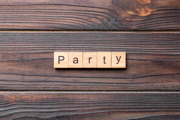 PARTY word written on wood block. PARTY text on cement table for your desing, concept