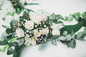 Wedding car decorated with beautiful, luxury flowers