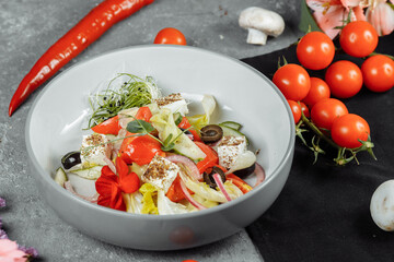 Traditional greek salad with fresh vegetables, feta cheese and olives. Top view. Selective focus