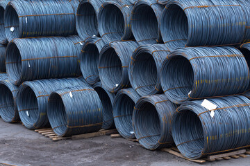 Steel low carbon wire rod, hot rolled steel drawing wire twelve millimeters or half an inch in diameter in coils. Freight transportation of heavy industry products by seaports. Export-import activity.