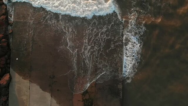 sea waves crashing over jetty top view gorai uttan  indian slow motion