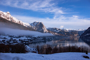 Amazing winter landscape with calm cold lake in Austrian alps.