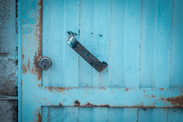 Blue background of metal steel old door - concept of business economy crisis