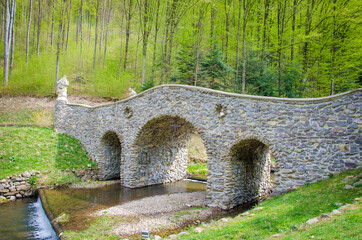 stone bridge over a small river. Voevodyno resort. beautiful landscape in the carpathians.