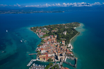 Aerial photography with drone. Aerial view on Sirmione sul Garda. Italy, Lombardy. Panoramic view at high altitude.  Rocca Scaligera Castle in Sirmione.