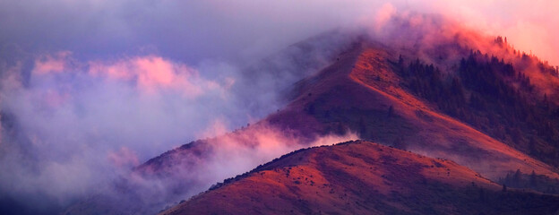 Mountain Wilderness with Clouds and Sunset Light