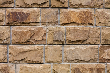 Texture of a stone wall. Part of a building wall. Close-up.