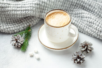 Cup of coffee, scarf and garland. Cozy autumn or winter composition. Scandinavian style