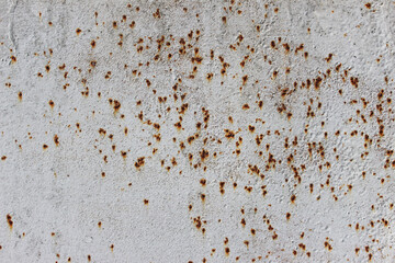 abandoned painted rusty metal for background. Corrosion of white painted metal. Pitting corrosion