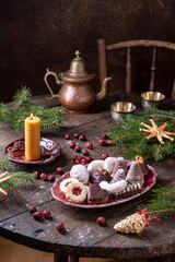 Traditional Christmas cookies on a plate on a rustic table