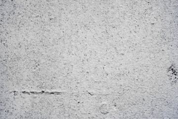 Texture of a concrete wall with cracks and scratches which can be used as a background