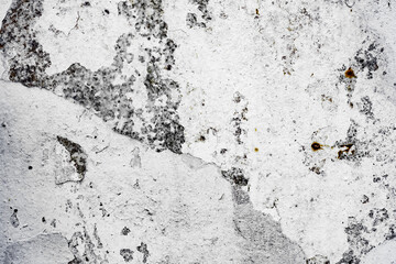 Texture of a concrete wall with cracks and scratches which can be used as a background