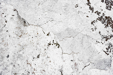 Texture of a concrete wall with cracks and scratches which can be used as a background