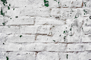 Texture of a brick wall with cracks and scratches which can be used as a background