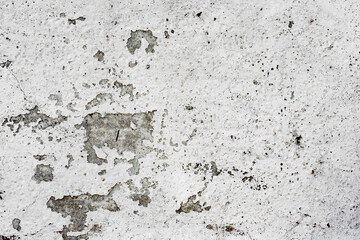 Texture of a concrete wall with cracks and scratches which can be used as a background