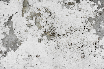 Texture of a concrete wall with cracks and scratches which can be used as a background