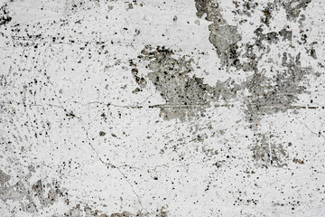 Texture of a concrete wall with cracks and scratches which can be used as a background