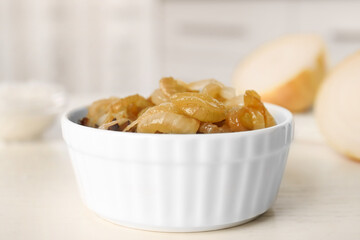 Tasty fried onion on white table, closeup