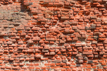 Obraz premium Full frame background of old broken red bricks wall (high details)