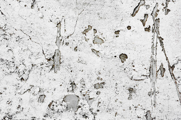 Texture of a concrete wall with cracks and scratches which can be used as a background