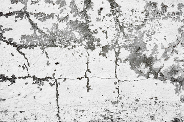 Fototapeta premium Texture of a concrete wall with cracks and scratches which can be used as a background