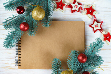 Fototapeta na wymiar Blank notebook with christmas decoration. top view.