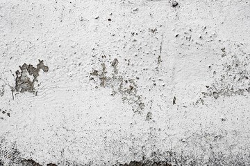 Texture of a concrete wall with cracks and scratches which can be used as a background