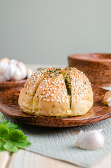 Korean Garlic Bread on Wood plate with Garlic Wood Background
