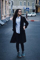 Beautiful Asian businesswoman walking down the street.