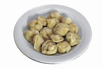 A portion of dumplings on a plate isolate on a white background close-up.