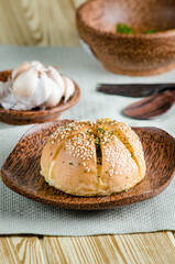 Korean Garlic Bread on Wood plate with Garlic Wood Background
