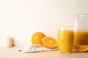 Orange juice and fresh fruits on wooden table. Space for text