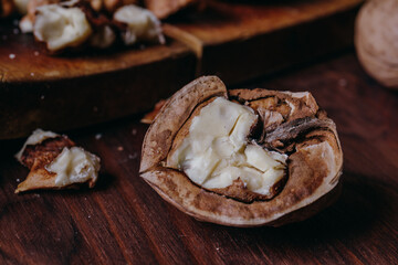 Half of walnut.Close-up on rustic old table. Macro shot.