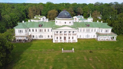 Fototapeta na wymiar Kachanivka, Ukraine - June 2020: Beautiful ancient Tarnovsky palace in Kachanivka, aerial view. Ukrainian heritage, tourist attractions. Landscape and park design