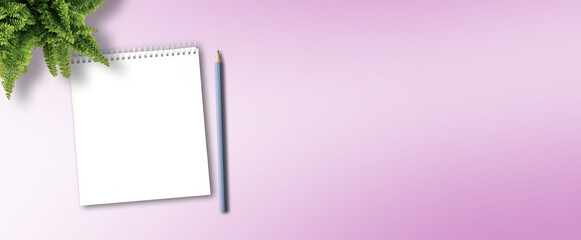 blank spiral notepad and pencil for taking notes on pink desk background