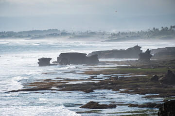 Scenery of wave hitting rocks on coastline