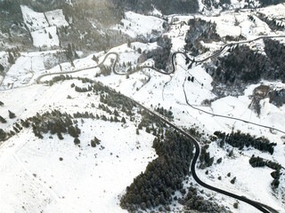 Long winding rural road with snow