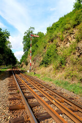 Fototapeta premium Industrial landscape with railroad in the nature. Railway junction in the bright summer day.